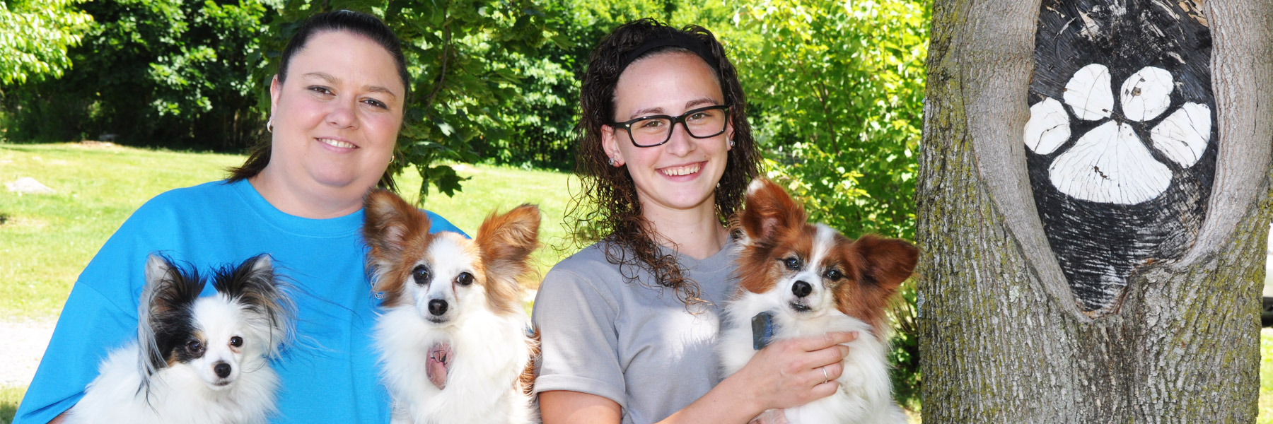 Melissa is holding Kristmas is on the left, and Jerzey Girl on the right. Shayla is holding a papillon, named Dublin.